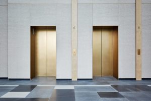 Brass elevator doors at Como Singapore  
